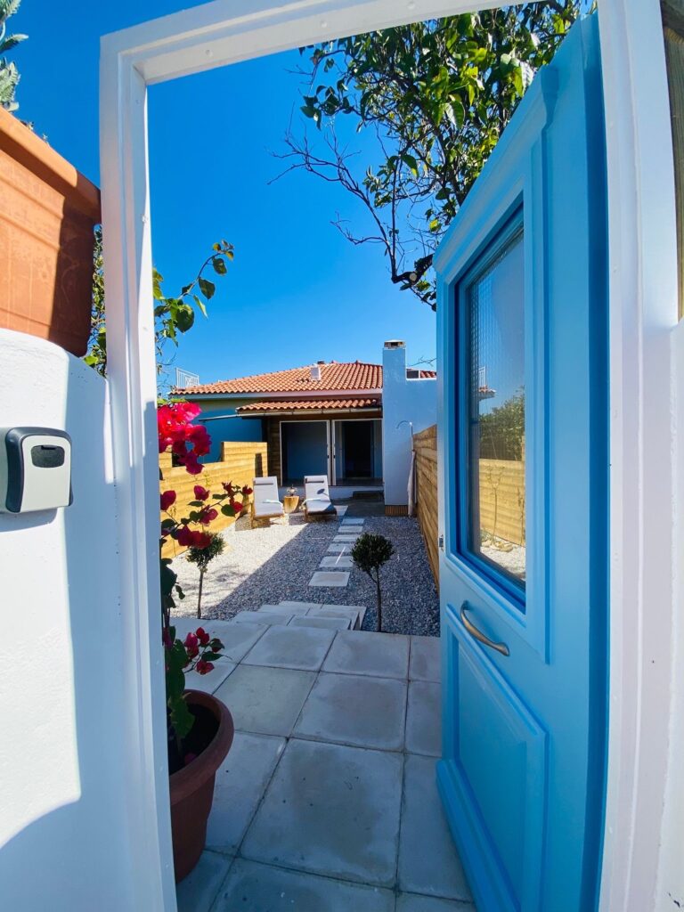 The blue door of the entrance to the garden of bougainvillea holiday home Samos with garden form Bougainvillea Holiday Home on Samos
